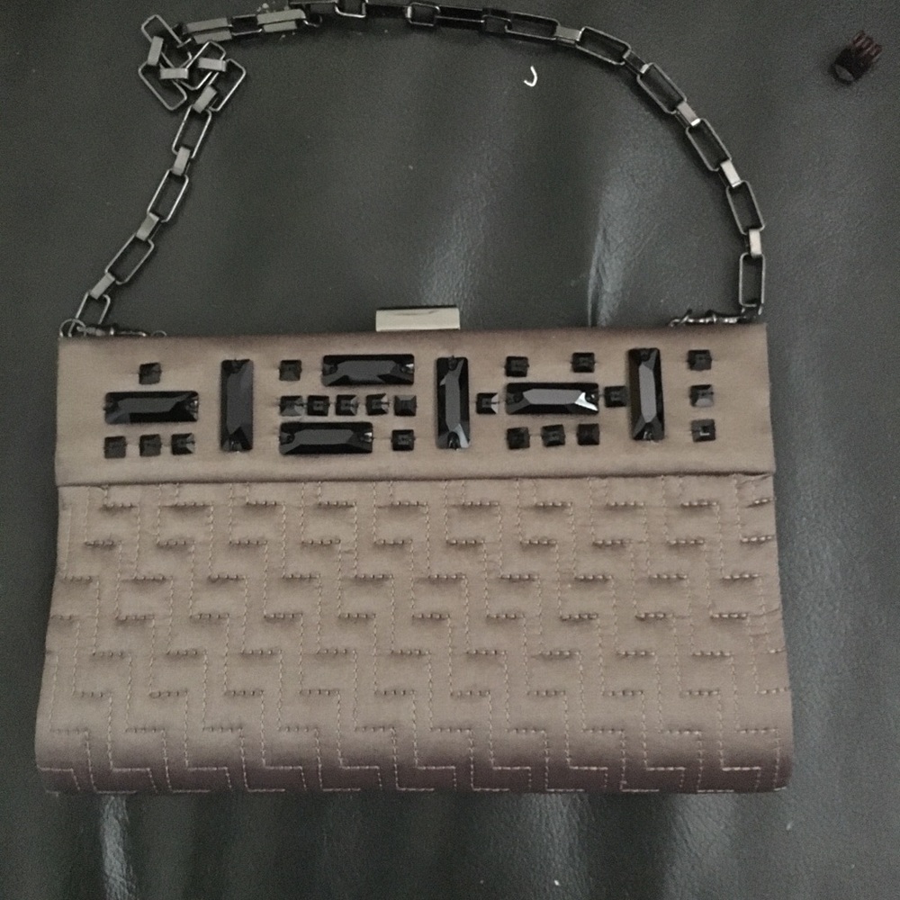 NWOT clutch. Excellent condition, brown gray